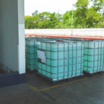 chemistry white tank on pallets are storage in the warehouse factory to be packed