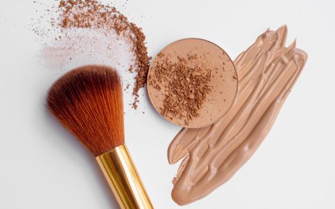 foundation-and-powder-brush-on-white-background